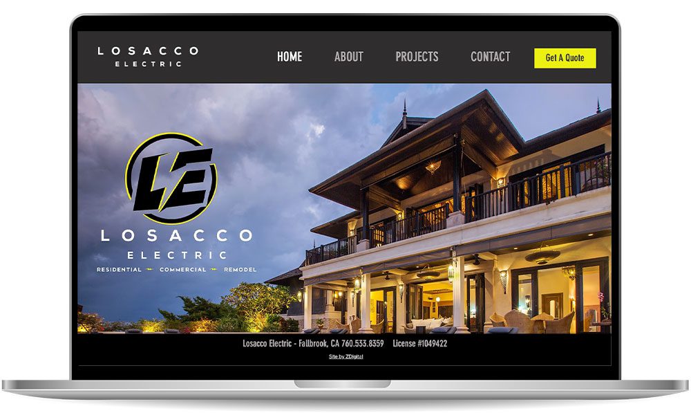 A laptop display shows the homepage of Losacco Electric's website, featuring a large luxurious house, navigation menu, and company logo.